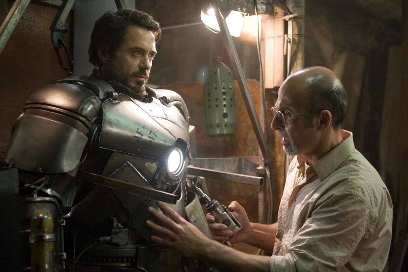 Tony-Stark-Robert-Downey-Jr.-left-is-fitted-into-his-Mark-I-armor-by-Yinsen-Shaun-Toub-right-in-Iron-Man.-Photo-Credit-Zade-Rosenthal.-2008-MVLFFLLC.-2008-Marvel-Entertainment.-All-rights-reserved-32.jpg